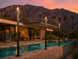 Gothic Fire Torch — Palm Springs pool at dusk