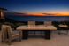Alameda 60" Fire Table – White Limestone, front elevation, Malibu terrace at dusk.