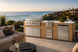 Pacific 112" BBQ Island - Weathered Oak, Del Mar terrace dusk