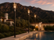 Roman Fire Torch — Montecito pool at dusk