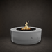 Unity Fire Pit in Stainless Steel with lit flame, studio composite